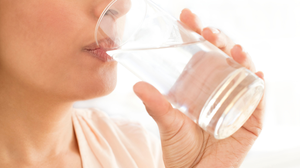 woman drinking glass of water