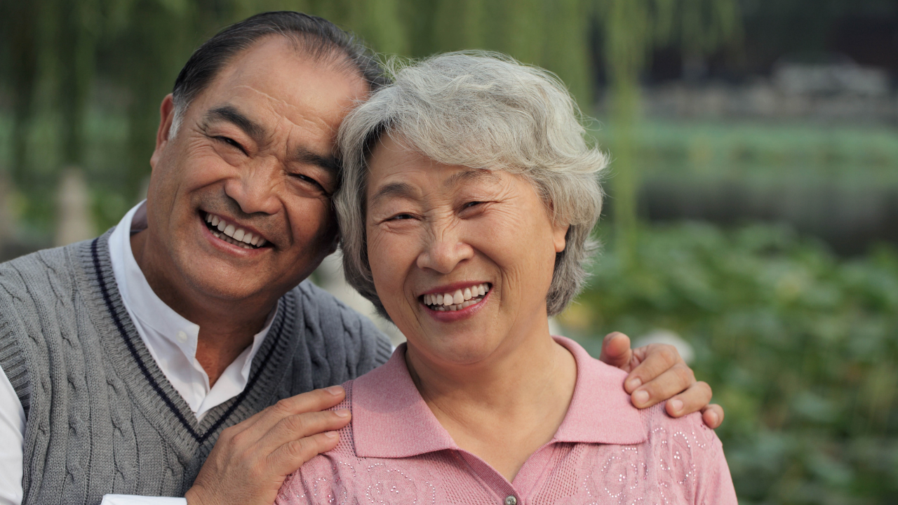 two older asian adults smiling