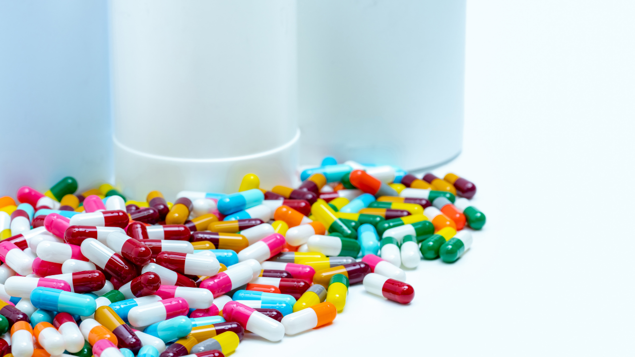 multiple medication capsules in a pile
