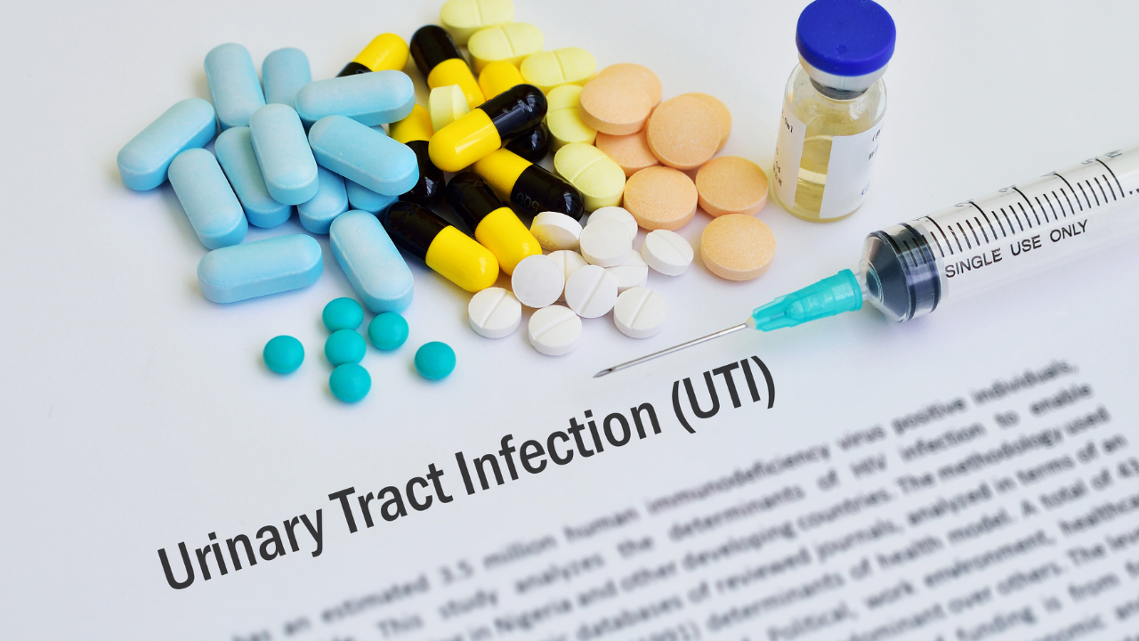 Pills and tubes with words urinary tract infection