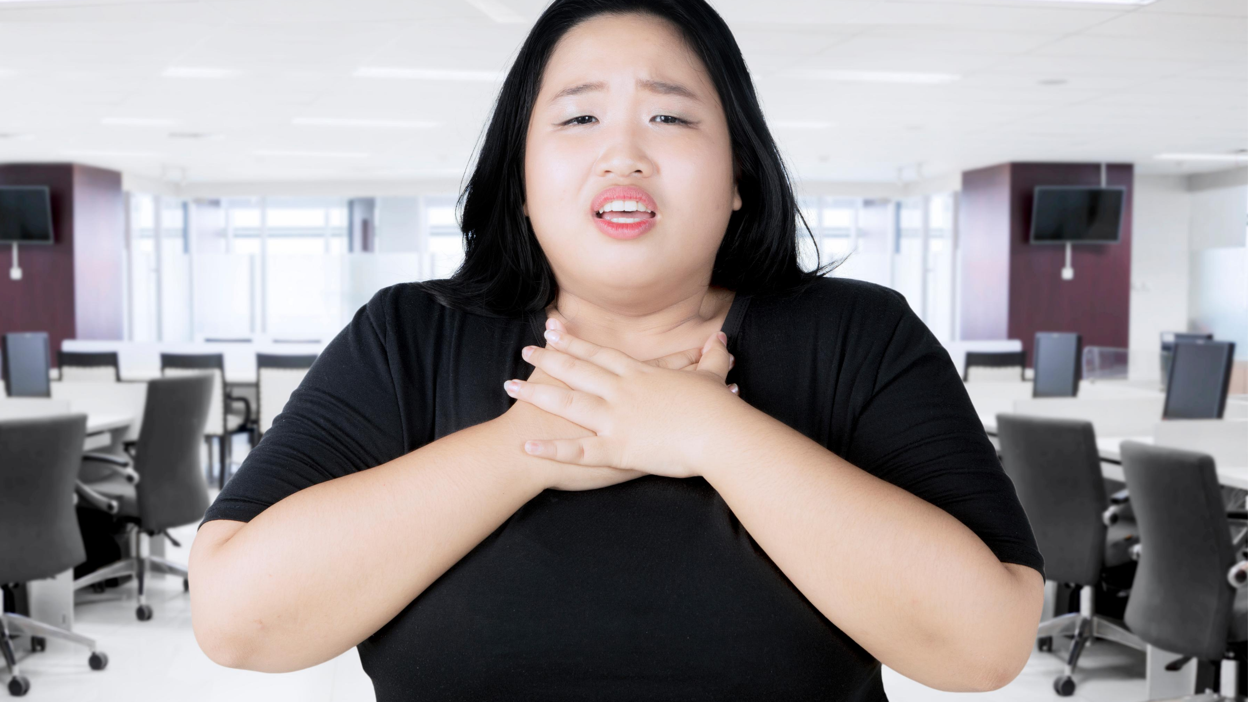 asian woman having difficulty breathing