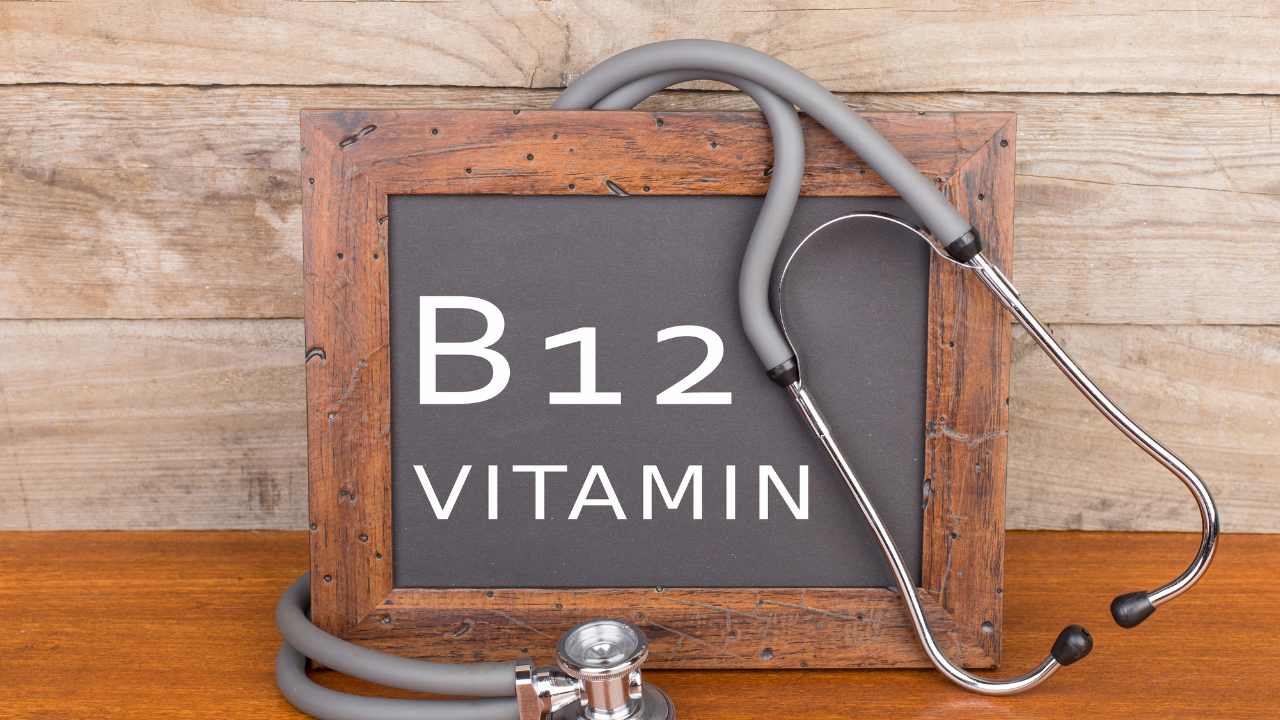 Words B12 Vitamin on a chalkboard with a stethoscope hanging on it