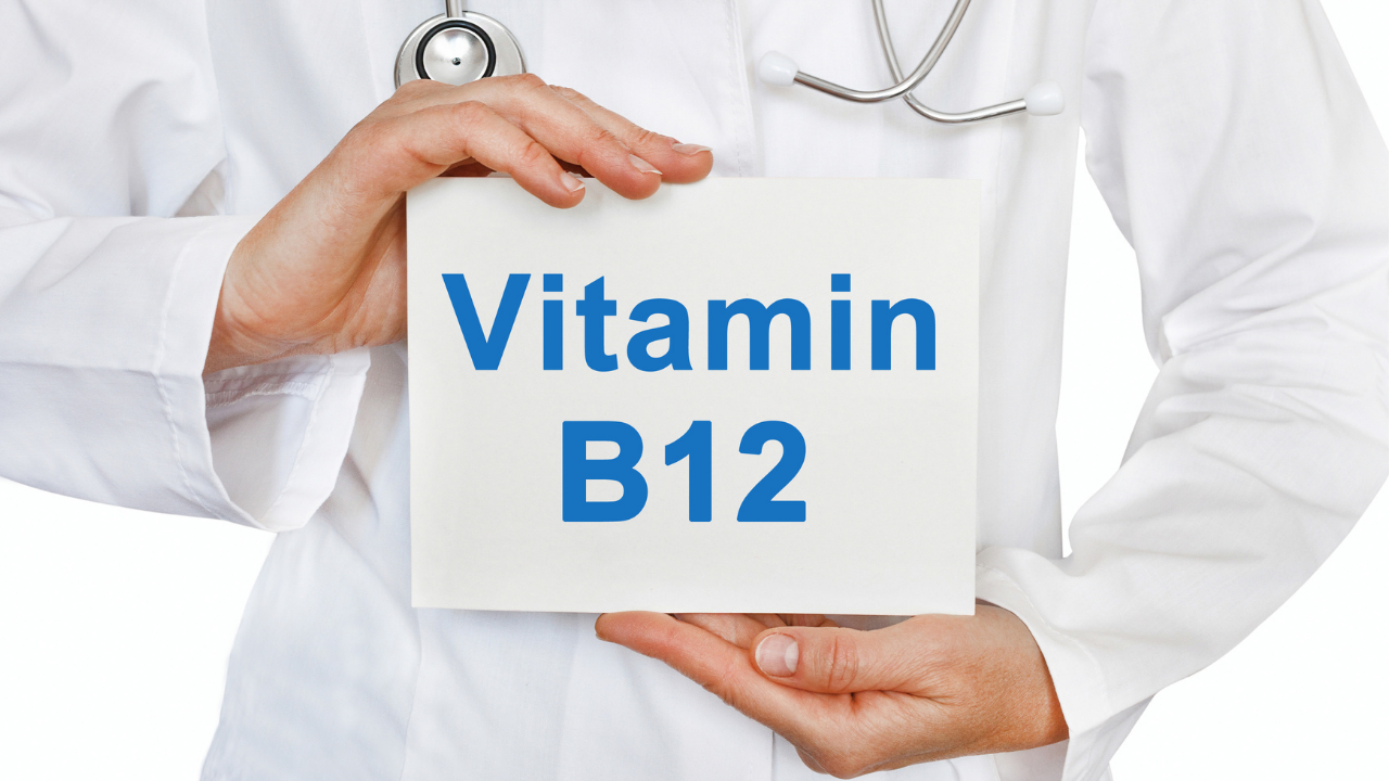 Doctor with stethoscope holding words Vitamin B12