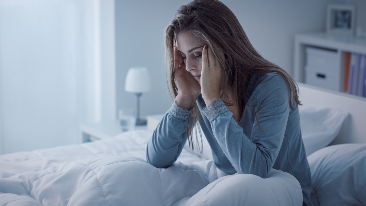 anxious woman touching her forehead