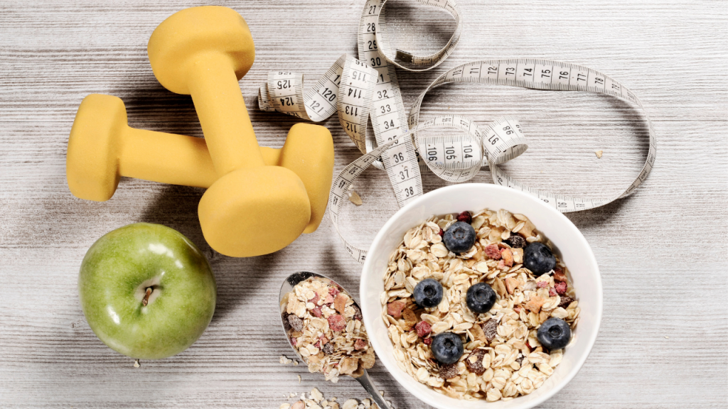 weight, apple and tape measure with a bowl of oatmeal with berries