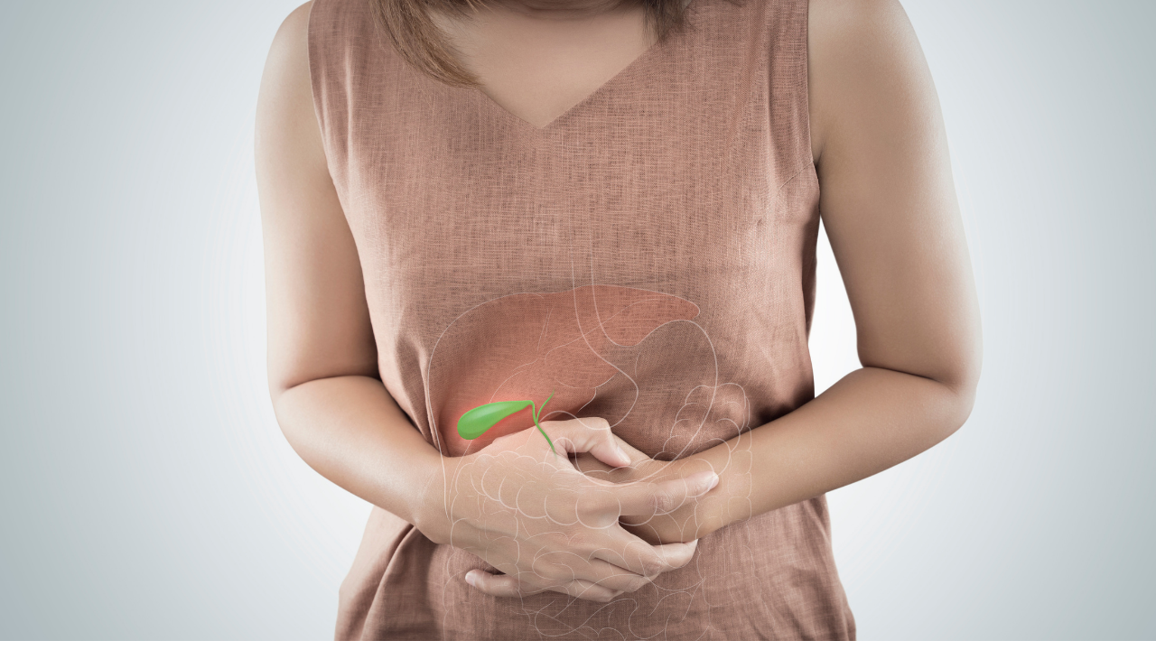 woman holding her abdomen in pain