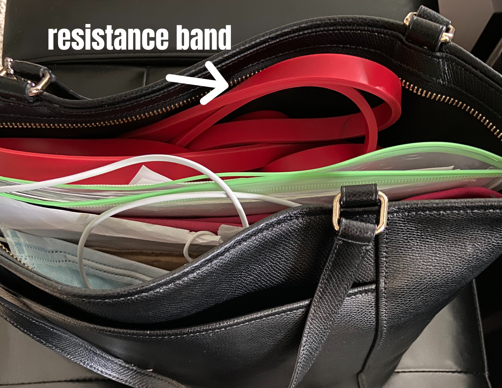 red restance bands in a hand bag