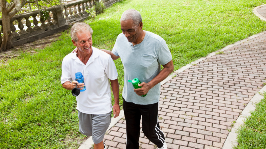 two men exercising with weights while walking